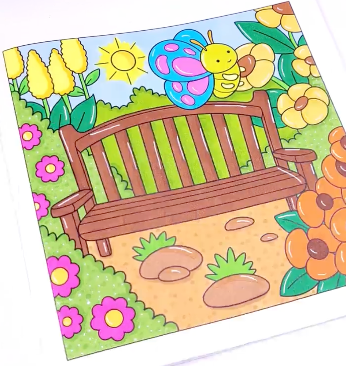Hand-colored example of the garden bench butterfly coloring page from Comfy Vibes printable pack